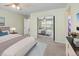 Main bedroom with mirrored closet doors and ceiling fan at 33 Gaviota Ave, Brighton, CO 80601