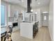 Modern kitchen with white cabinets, stainless steel appliances, and an island at 1450 N Williams St, Denver, CO 80218