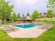 Community pool with plenty of lounge chairs at 23602 Pondview Pl, Golden, CO 80401