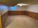 Finished basement with wood paneled walls at 6300 W Mansfield Ave # 64, Denver, CO 80235