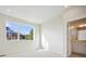 Bright bedroom with ensuite bathroom and large window at 461 Interlocken Blvd # 105, Broomfield, CO 80021