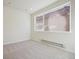 Spacious carpeted bedroom with large window at 461 Interlocken Blvd # 105, Broomfield, CO 80021