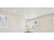 Bright bedroom with large windows and hardwood floors at 461 Interlocken Blvd # 105, Broomfield, CO 80021