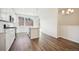 Modern kitchen with white cabinets and island at 461 Interlocken Blvd # 105, Broomfield, CO 80021