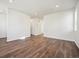 Spacious living room with hardwood floors and neutral walls at 461 Interlocken Blvd # 105, Broomfield, CO 80021
