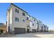 Row of contemporary townhouses with attached garages at 461 Interlocken Blvd # 105, Broomfield, CO 80021