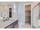 Modern bathroom with walk-in shower, vanity, and linen closet at 574 Agoseris Way, Castle Rock, CO 80104