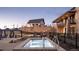 Relaxing hot tub area with surrounding landscaping and clubhouse view at 574 Agoseris Way, Castle Rock, CO 80104