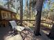 Spacious deck overlooking a wooded area, perfect for relaxing and enjoying nature at 8782 S Ault Ln, Morrison, CO 80465