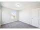 Spacious bedroom with a window, carpet, and neutral walls at 4606 N Bend Way, Firestone, CO 80504