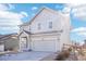 Two-story house with gray siding, attached garage, and landscaping at 4606 N Bend Way, Firestone, CO 80504