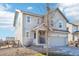 Two-story house with gray siding, attached garage, and landscaping at 4606 N Bend Way, Firestone, CO 80504