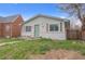 Charming single story home with green door and landscaping at 3619 N York St, Denver, CO 80205