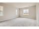 Bright bedroom with neutral carpeting and window at 2549 Lupton Ln, Lafayette, CO 80026