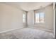 Spacious bedroom with neutral wall paint, carpet flooring and large windows at 2549 Lupton Ln, Lafayette, CO 80026