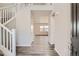 Bright and airy entryway with hardwood floors and a view into the living room at 2549 Lupton Ln, Lafayette, CO 80026