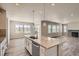 Large kitchen island with granite countertop, perfect for casual dining and meal prep at 2549 Lupton Ln, Lafayette, CO 80026