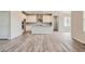 Bright and spacious kitchen features white cabinets and a large island at 2549 Lupton Ln, Lafayette, CO 80026