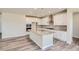 Modern kitchen with white cabinets, granite countertops, and an island at 2549 Lupton Ln, Lafayette, CO 80026