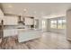 Open concept kitchen boasts granite countertops, stainless steel appliances, and ample cabinet space at 2549 Lupton Ln, Lafayette, CO 80026