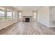 Living room featuring a stone fireplace and hardwood floors at 2549 Lupton Ln, Lafayette, CO 80026