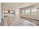 Open concept main living area with kitchen, living room, and dining area at 2549 Lupton Ln, Lafayette, CO 80026