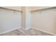 Spacious walk-in closet with double hanging rods and neutral carpeting at 2549 Lupton Ln, Lafayette, CO 80026