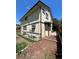 Rear view of the house showing the backyard and a patio at 14190 E Gunnison Pl, Aurora, CO 80012