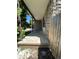 Stone front porch with a concrete landing and wooden fence at 14190 E Gunnison Pl, Aurora, CO 80012