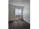 Well-lit bedroom with carpeted floors and window coverings at 14190 E Gunnison Pl, Aurora, CO 80012