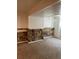 Unfinished basement with stone accent wall and carpeted floor at 14190 E Gunnison Pl, Aurora, CO 80012