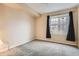 Comfortable bedroom with neutral walls and carpeted floors at 12933 Ironstone Way # 102, Parker, CO 80134