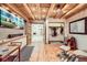 Western-themed basement living area with wood floors and ceiling at 6697 Wauconda Dr, Larkspur, CO 80118