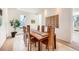 Dining room with wooden table, chairs, large window, and carpeted floor at 6697 Wauconda Dr, Larkspur, CO 80118