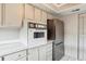 View of kitchen appliances, including a built-in oven and refrigerator at 9079 E Nassau Ave, Denver, CO 80237