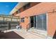 Brick patio with sliding glass door access at 9079 E Nassau Ave, Denver, CO 80237