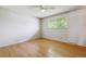 Hardwood floors and a ceiling fan in this bright bedroom at 9079 E Nassau Ave, Denver, CO 80237