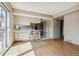 Eat-in kitchen with light cabinets and access to a patio at 9079 E Nassau Ave, Denver, CO 80237