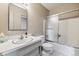 Clean bathroom with a single sink and shower/tub combo at 9079 E Nassau Ave, Denver, CO 80237