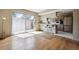 Kitchen with light cabinets, wood floors, and access to a patio at 9079 E Nassau Ave, Denver, CO 80237