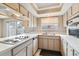 Modern kitchen with stainless steel appliances and a large window at 9079 E Nassau Ave, Denver, CO 80237
