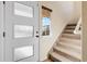 Interior entryway with staircase and frosted glass door at 19317 E 59Th Ave, Aurora, CO 80019