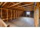 Unfinished attic space with exposed wooden beams and a small window at 234 Lansing St, Aurora, CO 80010