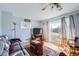 Bright living room with hardwood floors and sliding glass door at 10762 Blue Jay Ln, Northglenn, CO 80233