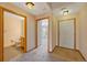 Bright entryway with tile flooring, powder room, and access to living room at 8201 S Winnipeg Ct, Aurora, CO 80016