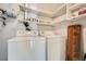 Laundry room with washer, dryer, and shelving at 6420 S Dayton St # J06, Englewood, CO 80111