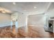 Open concept living and kitchen area with hardwood floors at 6420 S Dayton St # J06, Englewood, CO 80111