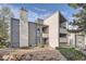 Exterior view of a multi-level building with grey siding and balconies at 6420 S Dayton St # J06, Englewood, CO 80111