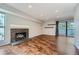 Living room with hardwood floors, fireplace and balcony access at 6420 S Dayton St # J06, Englewood, CO 80111