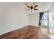 Spacious bedroom with hardwood floors and ceiling fan at 6420 S Dayton St # J06, Englewood, CO 80111